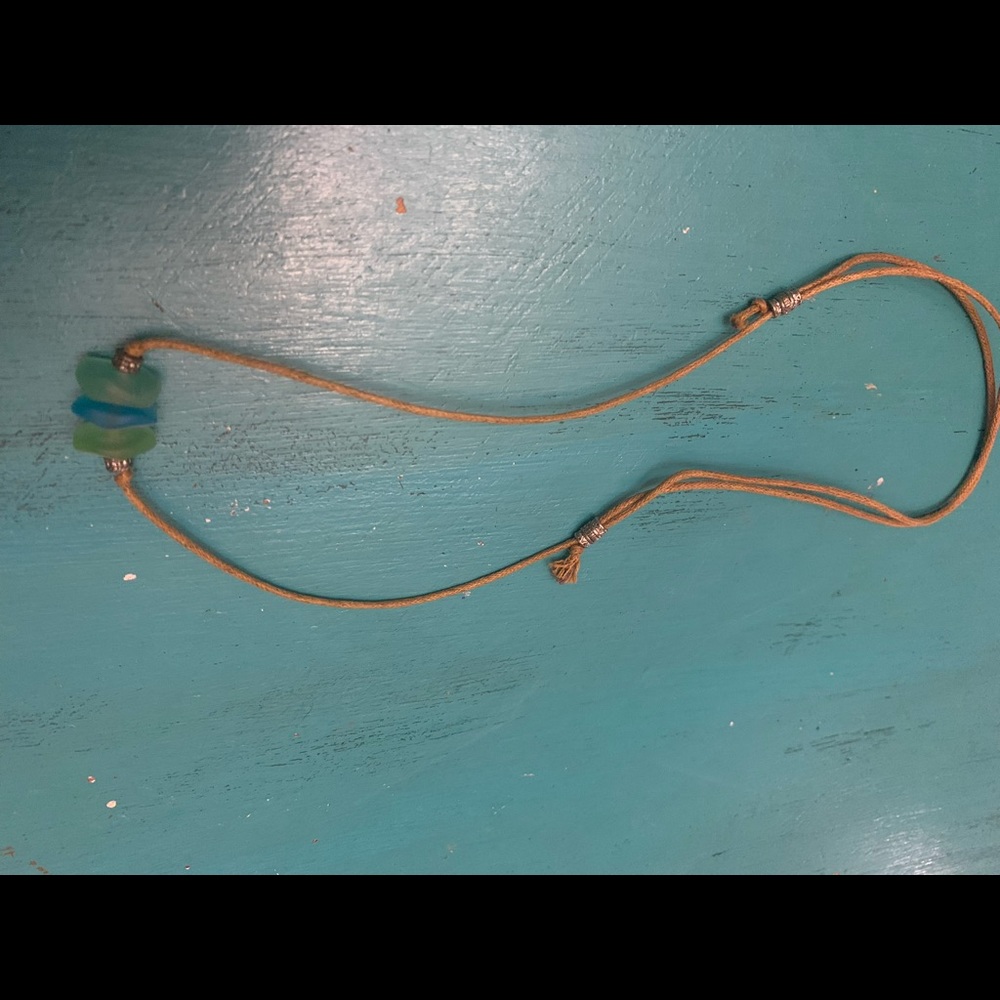 Adjustable leather necklace with sea glass.